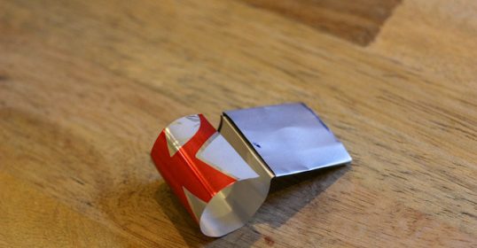 A piece of paper on a wooden table.