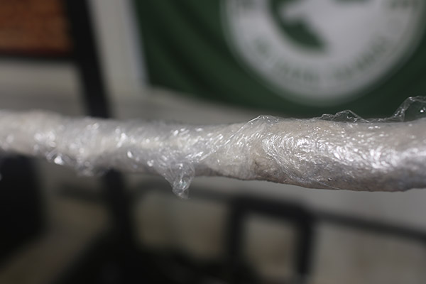 Wrapped plastic on barbell.