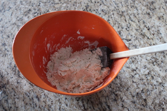 Mixing of dough in a bowl.
