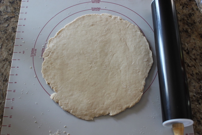 Rolled dough with rolling pin.