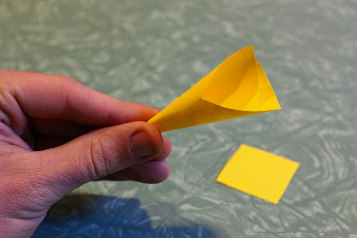 Rolled post-It note.