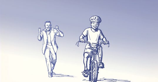 A man rides a bicycle.