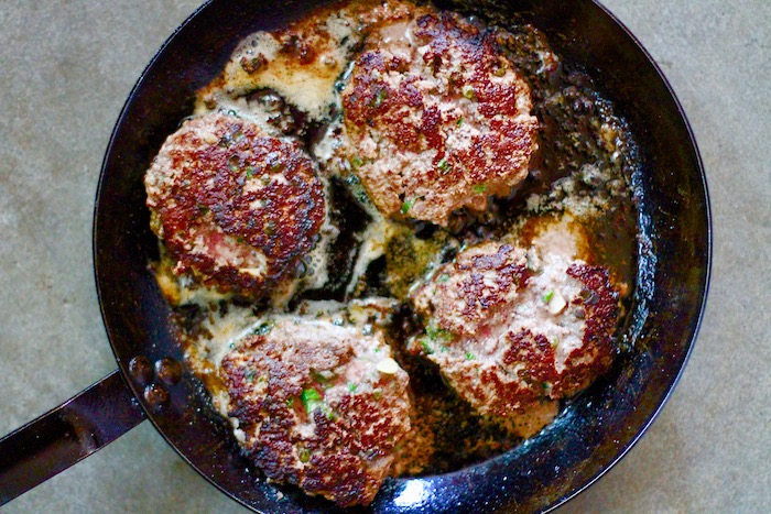 Fried patties in a pan.