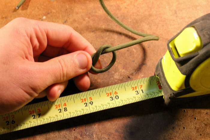 Step 1: Tie a simple overhand knot about 30 inches from one end of your paracord.