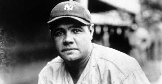 A vintage photo of a baseball player in black and white.