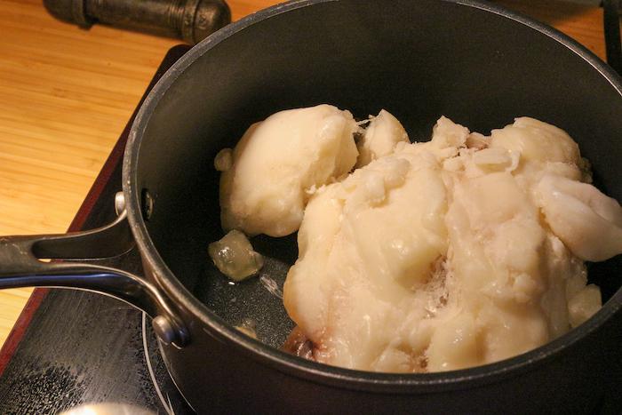 Suet being rendered in pan.