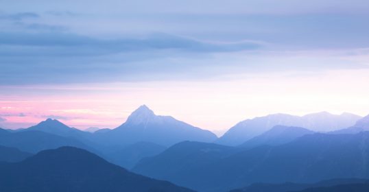 A mountain range in the stillness of dusk.