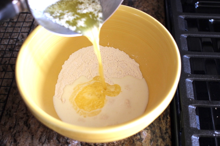 Adding milk and butter in a bowl.