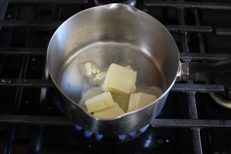 Melting butter in a pan.