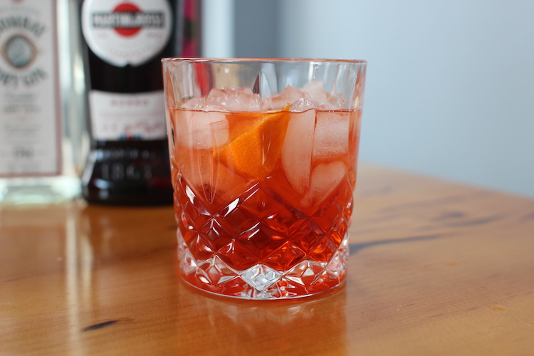 Negroni in a glass with ice cubes.
