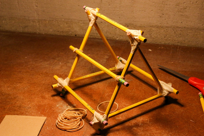 Pyramid shape formed with the help of pencils. 