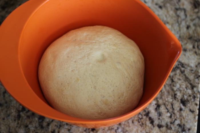 Covered dough kept in bowl.