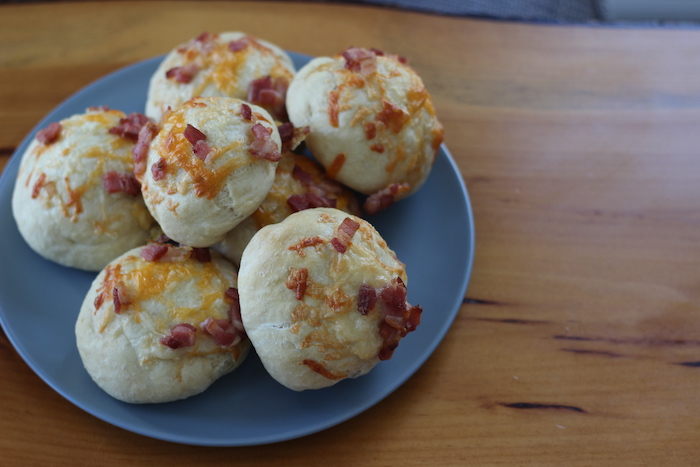 Tasty cheese bacon rolls being served.