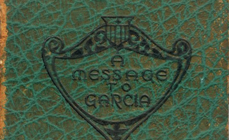 A message to Carla is written on the green book.