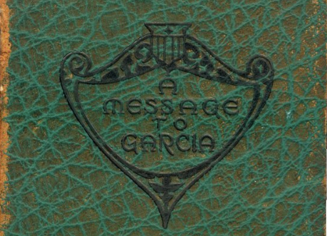 A message to Carla is written on the green book.