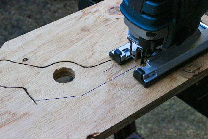 Cutting out the gun's drawing with a jigsaw.