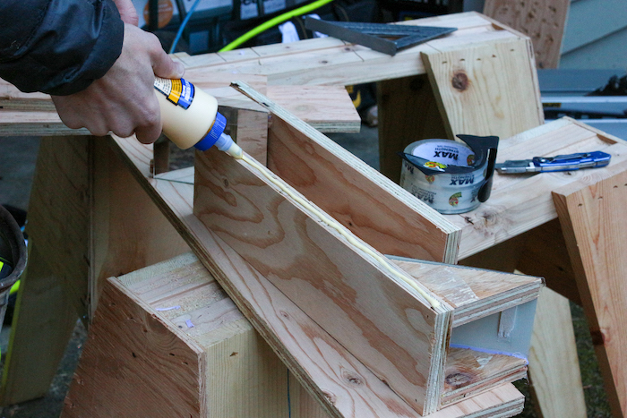 Gluing the side of plywood.