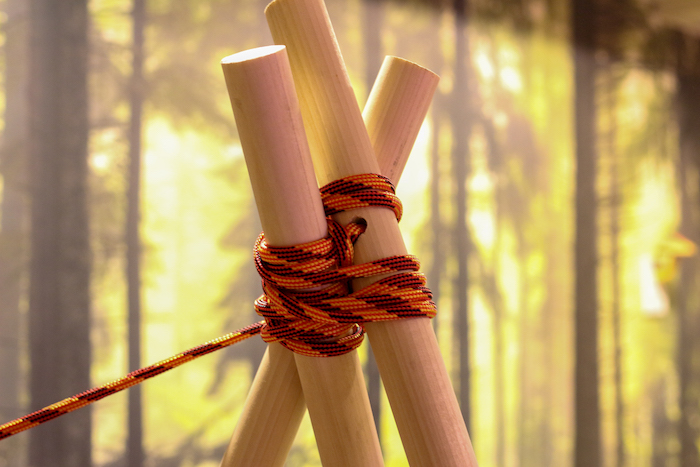 Three Poles attached with rope.