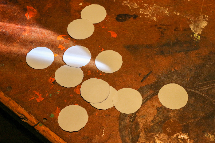 Quarter shaped papers placed on table.