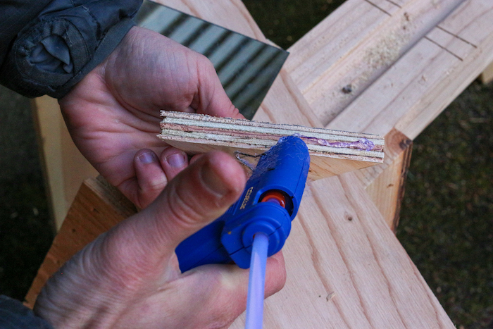 Glue being attached to plywood. 