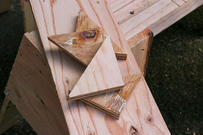 Stack of triangular shaped plywood.