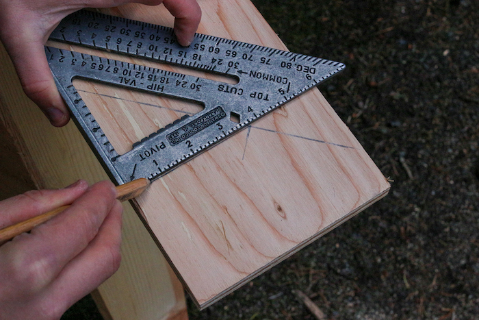 Measurements done on plywood with the help of protractor.