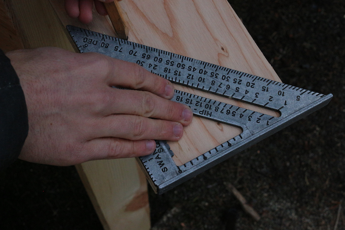 Marking angles on plywood.