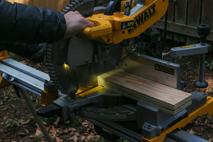 Cutting plywood with machine.