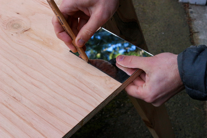 Measuring and cutting the plywood.