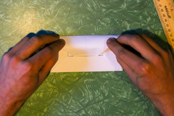 Wrapping up the envelope with hands.