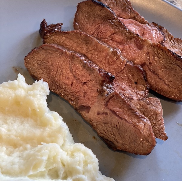 Asian inspired Flat iron steak served with mashed potato.