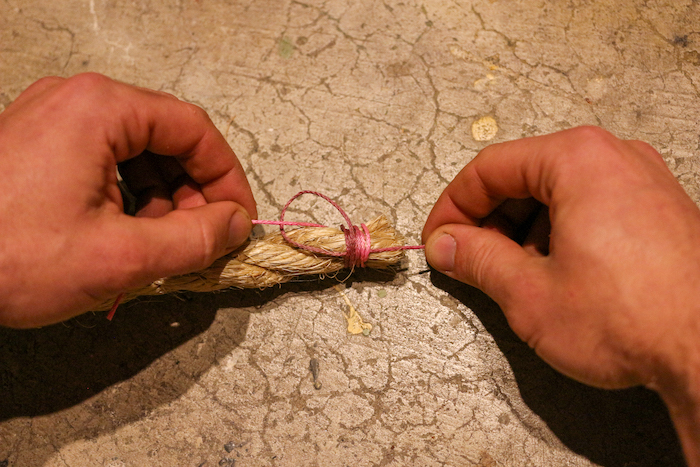 Pull both ends of your twine tight, then trim the ends of the twine.