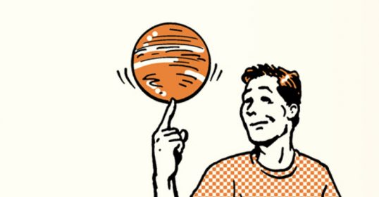 A man is spinning an orange basketball on his finger.