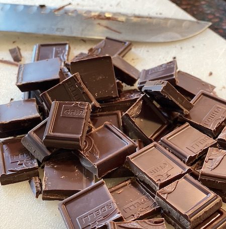 Pieces of chocolates with knife.