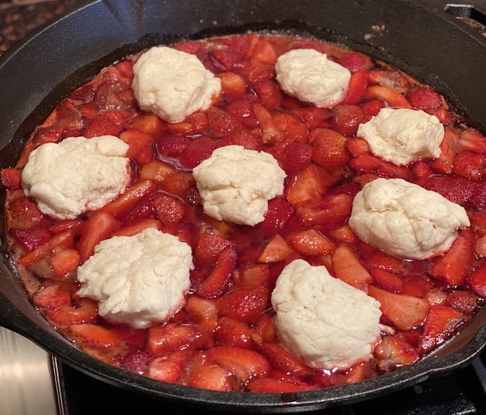 Strawberries with butter in a pan.
