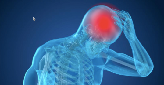 A man is holding his head in pain, indicating he may have a concussion.