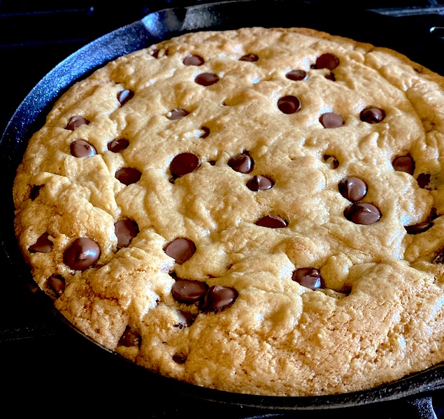 Delicious chocolate chip cookie in a backing pan.