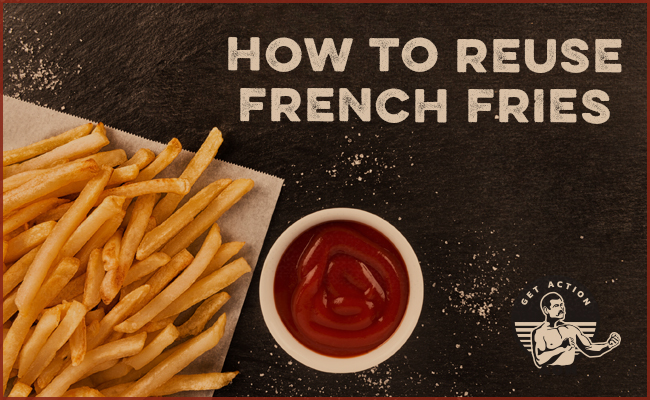 French fries with a bowl of ketchup on a table.