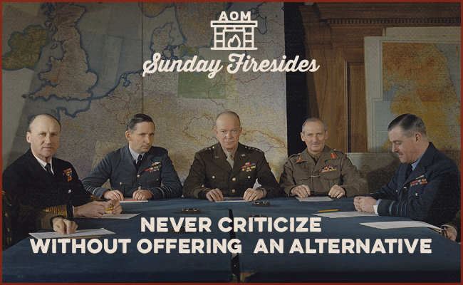 General Dwight D. Eisenhower sitting with his staff to study certain problems during War II.