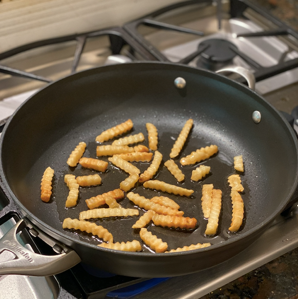 Refry fries in fryingpan.