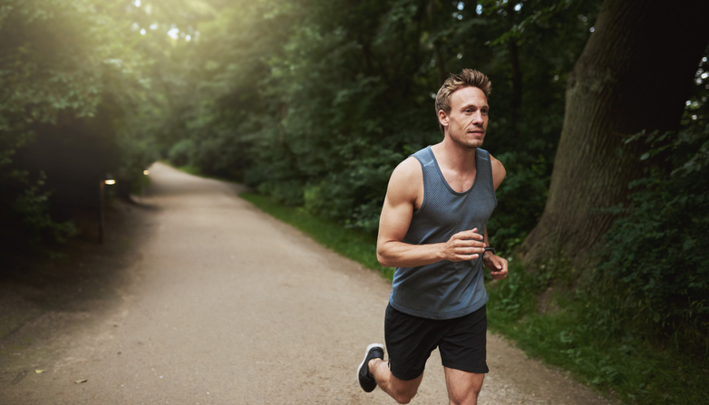 A man jogging on a track.