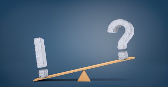 A seesaw with a question mark, posing a paradox.