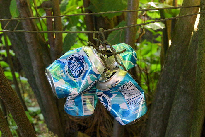 Attaching cans with a wide paracord.