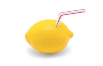 lemon with straw in it white background.