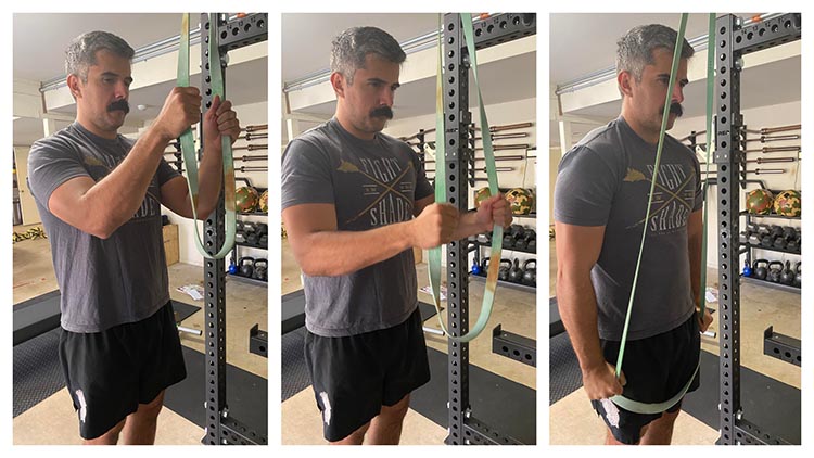 Man demonstrating banded tricep pushdowns