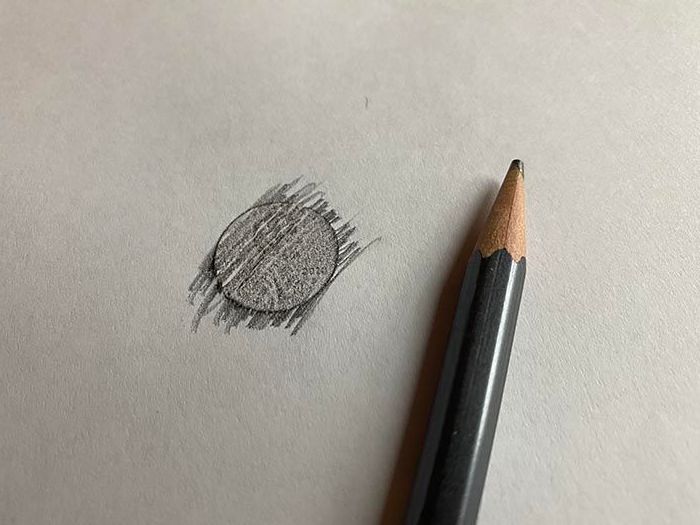 pencil rubbing of a coin. 