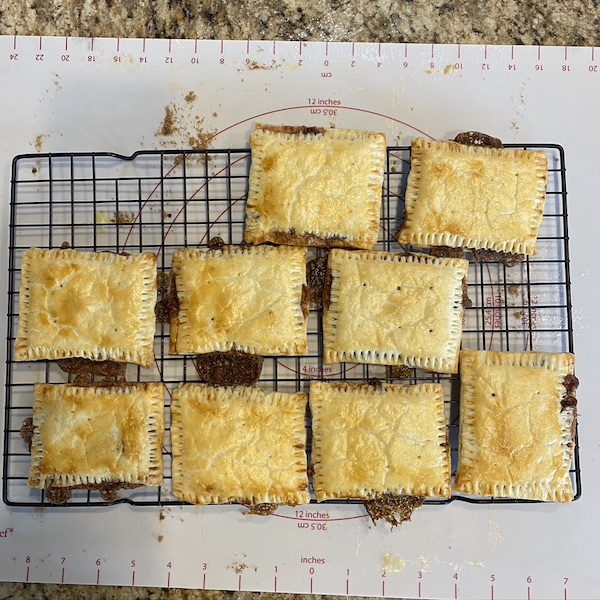 cooked pop tarts cooling on a rack. 