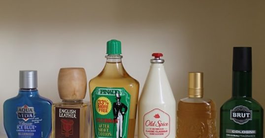 A collection of various alcoholic beverages displayed on a shelf at the drugstore.