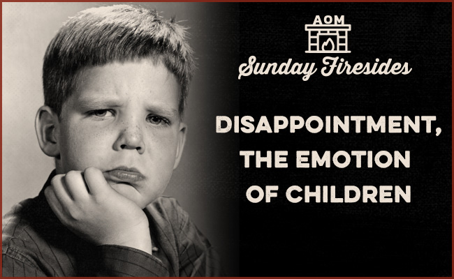 A black and white photo capturing the emotion of disappointment in a child.