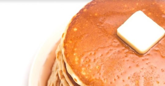 Upgrade your instant mix pancakes with a generous slab of butter on top.